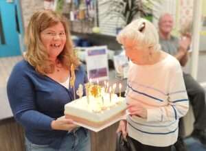 Eva and Cath holding 100th year birthday cake